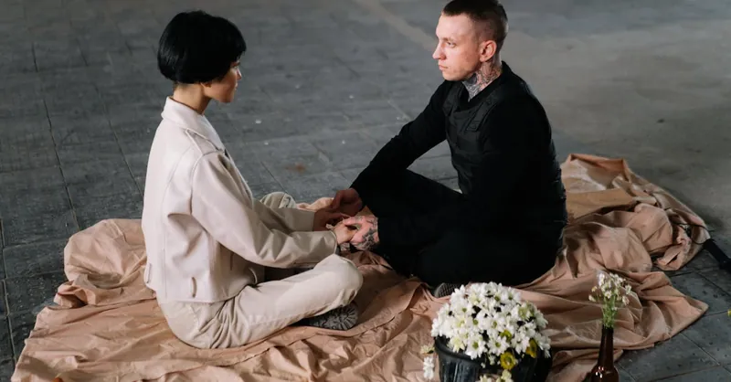 Two individuals having a calm interaction indoors, fostering connection and understanding.