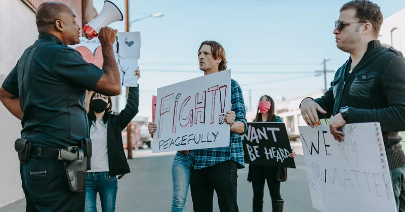 A peaceful protest with diverse individuals and police interaction, emphasizing unity and civil rights.