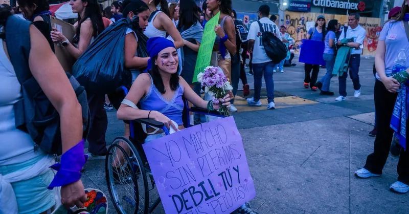 Protesters gather in a city, showcasing empowerment and unity.